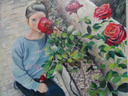 Niña con rosal