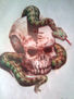 calavera con serpiente