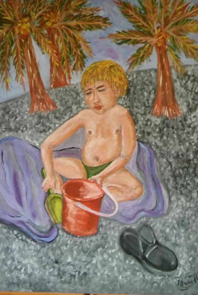 niño jugando en la playa