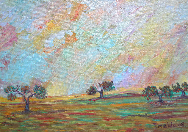 Puesta de sol con encinas