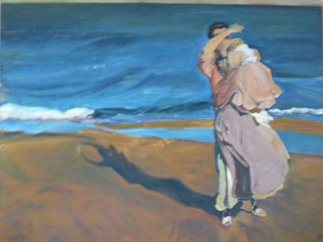 Muchacha con bebe en la playa