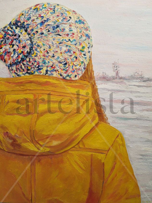 Chica con anorak amarillo y gorro