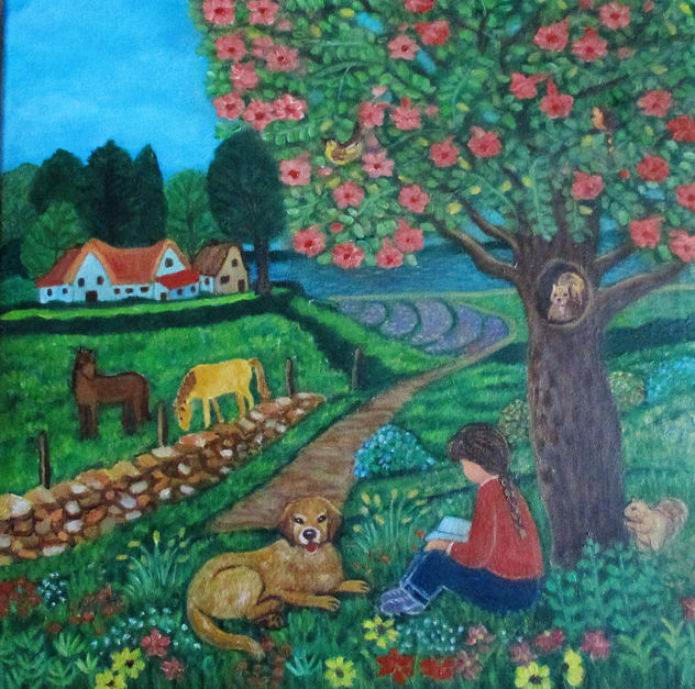 una chica leyendo junto a un arbol.