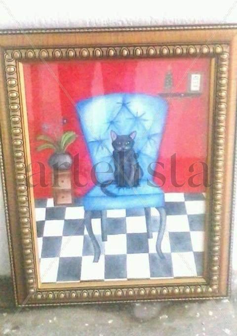 Gato en sillón azul
