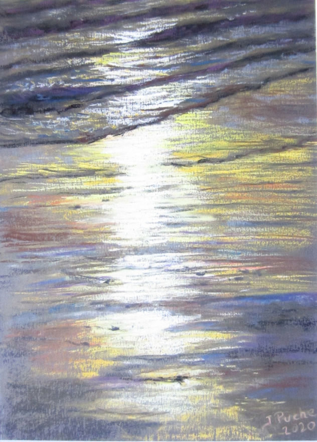Reflejos en la arena al anochecer