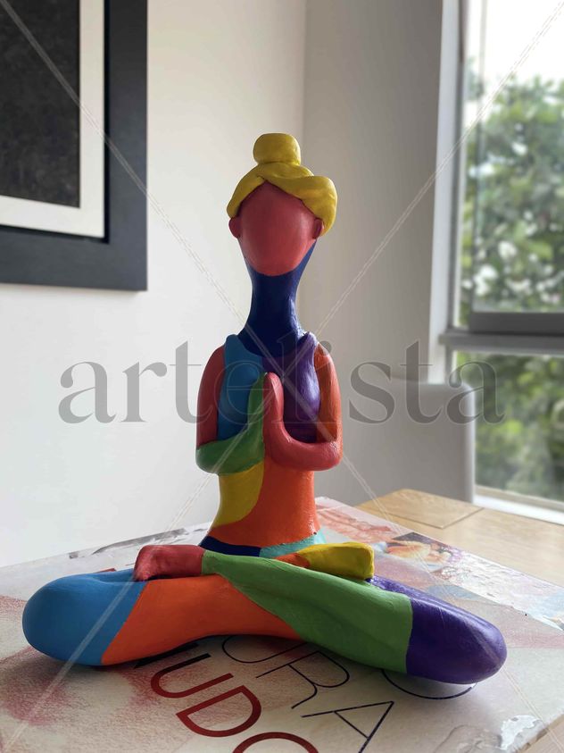 Colorful yogi sculpture