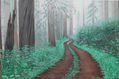 Camino por bosque con niebla