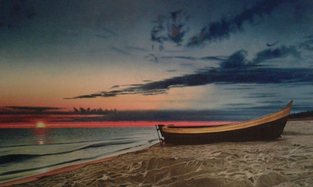 Atardecer en la playa con barca