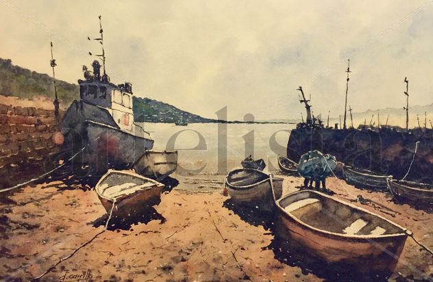 Muelle y barcos varados al atardecer