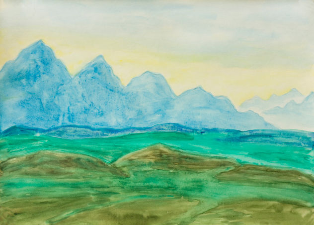 Blue hills on yellow sky