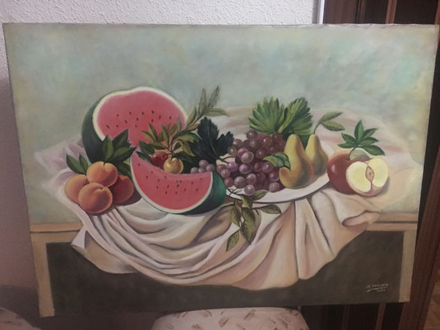 Bodegon con melon y frutas en mantel