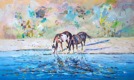 Caballos tomando agua.