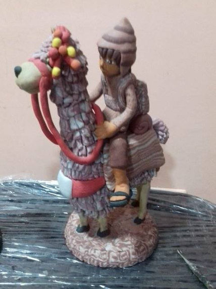 Niño con llamita