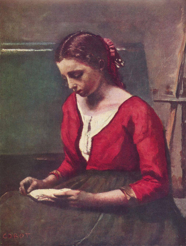 Chica leyendo con camiseta roja