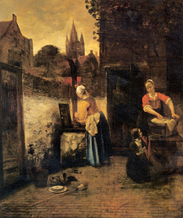 Dos mujeres con un niño en el patio.