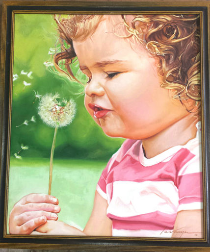 Niña soplando...