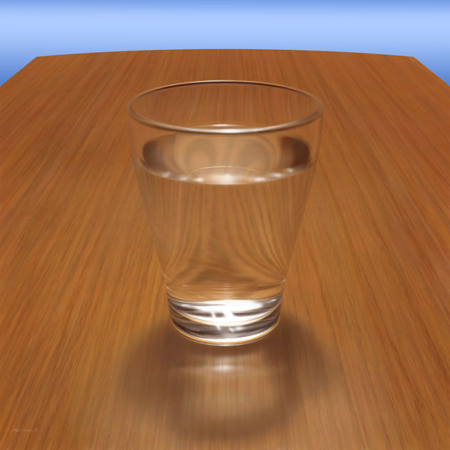 UN VASO DE AGUA SOBRE UNA MESA DE MADERA