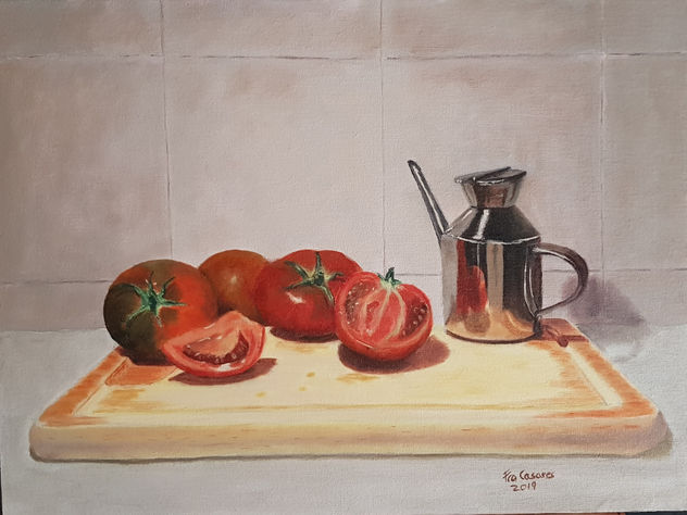 Tomates, tabla y aceitera