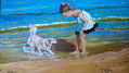 NIÑA JUGANDO CON PERRO EN LA PLAYA