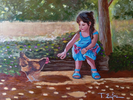 Niña alimentando a...