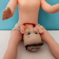 Young Doll Giving Birth to a Monk by a Cesarean Section — front