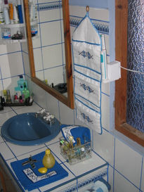 Porta frascos de baño