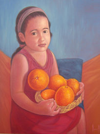 Niña con naranjas