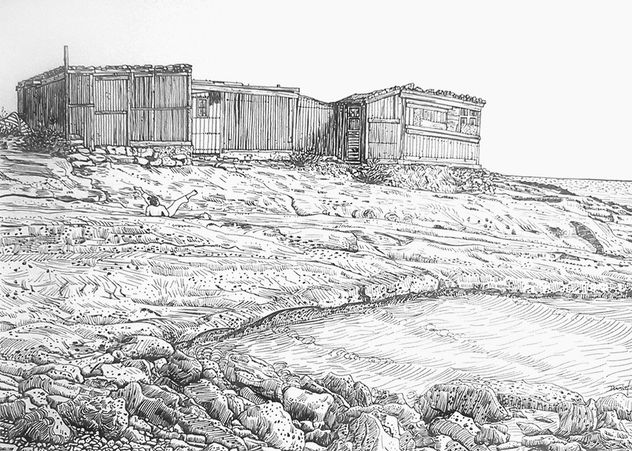 Casetas de pescadores con rocas y mar