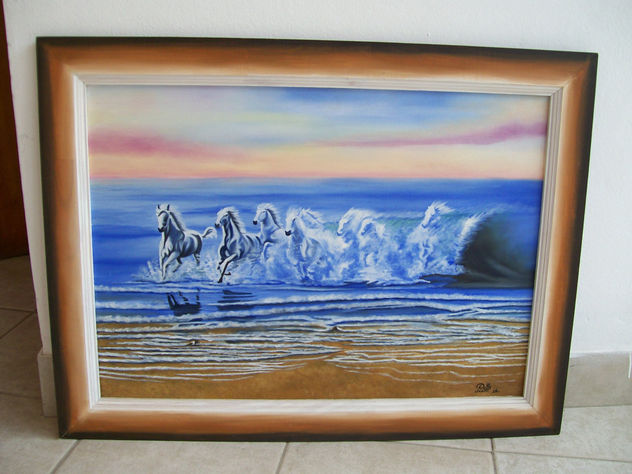 Caballos saliendo del mar