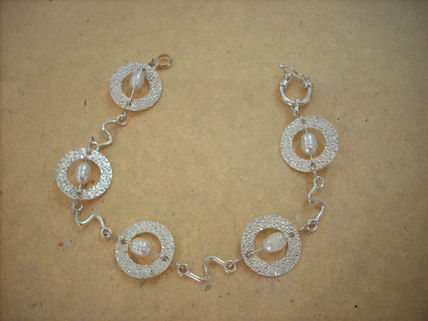 Pulsera argollas  y...