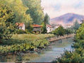 rio en Villaviciosa. En ella se muestra el rio y un horreo entre casas.