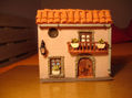 Casita sobre caja de CD