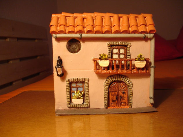 Casita sobre caja de CD