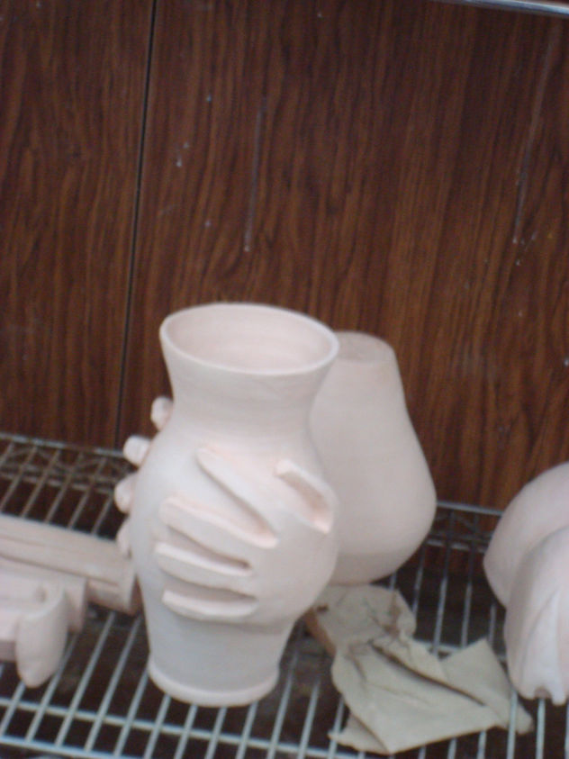 manos  en vase