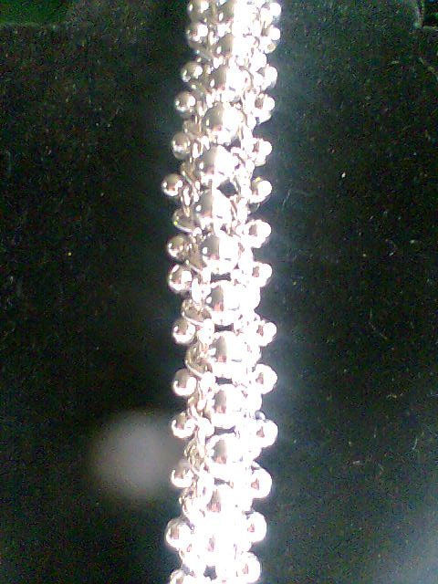 Pulsera tejida en cadenas y billas