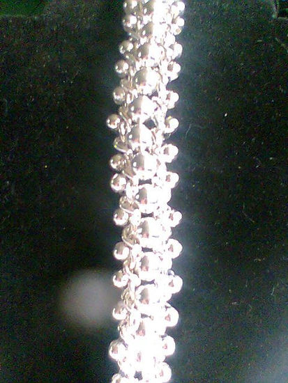 Pulsera tejida en cadenas y billas 