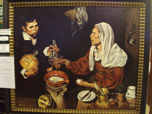 La vieja friendo huevos