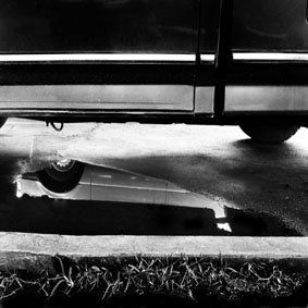 charco bajo coche