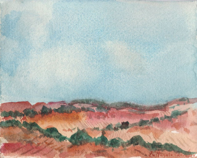 Paisaje con olivos en terreno rojizo