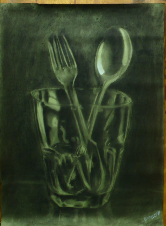 vaso con cubiertos