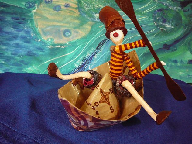 payaso remando en botecito