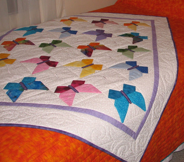 Quilt de mariposas multicolores 