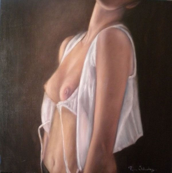 Una mujer desnuda y en lo oscuro