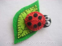 Broche mariquita