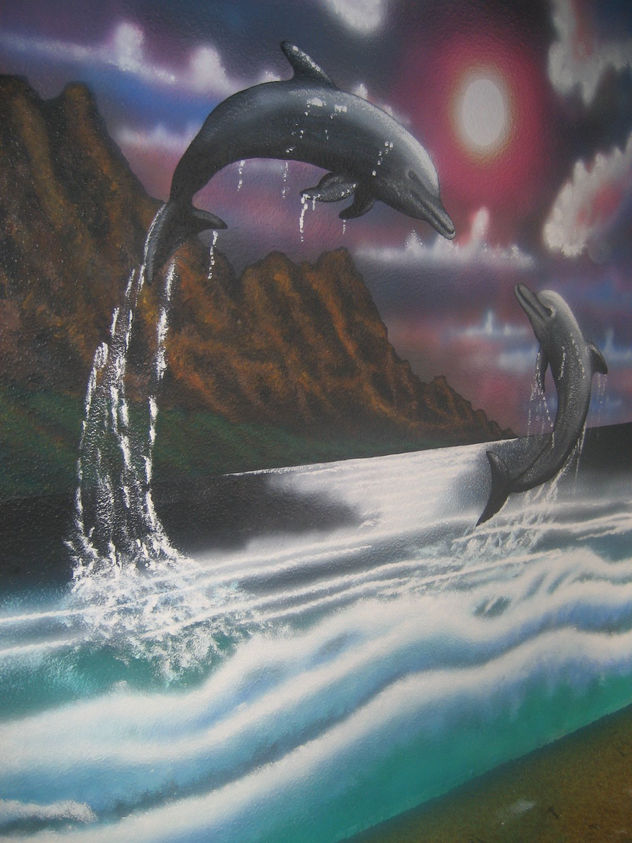 delfines sobre las olas....