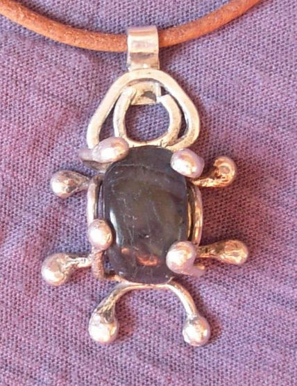 Amuleto de plata y...