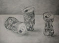 Still life with twisted cans of soda.