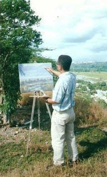 EL ARTISTA PLÁSTICO VENEZOLANO ING. FREDDY G. PEÑA  PINTANDO AL AIRE LIBRE.