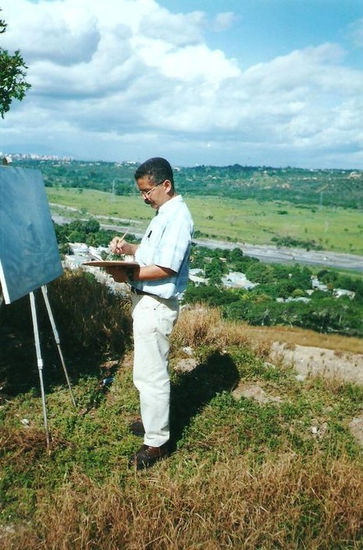 EL ARTISTA PLÁSTICO VENEZOLANO ING. FREDDY G. PEÑA  PINTANDO AL AIRE LIBRE. 