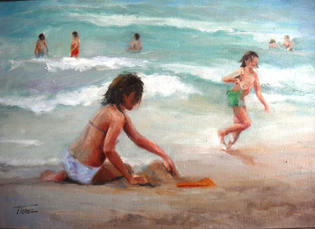 Jugando enla orilla del mar